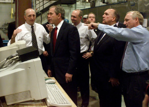 BUSH28p3 George W. Bush and Michigan Governor.John Engler get a tour of the Gallagher plant in Battle Creek,Michigan Friday morning. Kevin Hare/Battle Creek Enquirer.